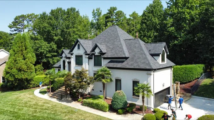 Triumph Roofing project on a white home with a complex gray roof in Waxhaw, North Carolina